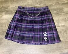 "NEW 666 Plaid Pleated Skirt Chain Charm Custom LittleBirdee Skirt Available in Small Med or Large Catholic style uniform skirt Embroidered with \"666\" Skirt is a purple, navy, black plaid Adjustable slide on hip Chain with pentagram charms Pair this up with our black 666 embroidered cardigan and ugh... so freaking cute... and spooky. Perfect for #goth #cybergoth #pastel #punk #cosplay" Purple And White Plaid Skirt, Purple Pleated Skirt, Skirt Chain, Purple Plaid Skirt, Hip Chain, Punk Cosplay, Style Uniform, Punk Skirt, Pastel Punk