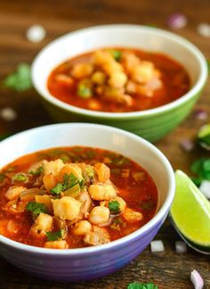 two bowls filled with soup and garnished with cilantro