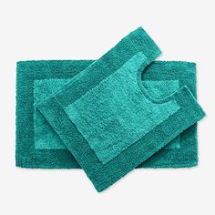 two green towels folded on top of each other