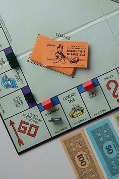 a monopoly board game with pieces of paper on it