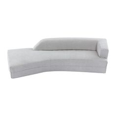 a white couch sitting on top of a white floor