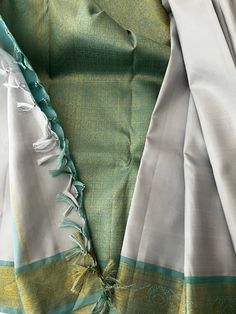 Beautiful Pure Kanchipuram Silk Saree in Silver Gray with Turquoise Blue Pure Zari Border and Blouse Piece- A unique piece of drape and unique color combination Unstitched Turquoise Saree For Wedding, Elegant Turquoise Saree For Diwali, Turquoise Silk Traditional Wear With Dupatta, Turquoise Salwar Kameez For Wedding And Diwali, Turquoise Blouse Piece For Wedding And Diwali, Turquoise Saree For Wedding And Eid, Turquoise Silk Saree With Pallu Detail, Elegant Turquoise Dupatta For Diwali, Turquoise Blouse Piece For Wedding And Festivals