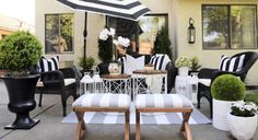 the patio is decorated with black and white striped furniture