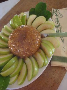 a plate with apples and peanut butter on it