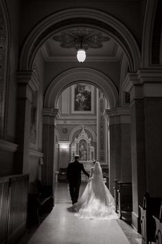 the bride and groom are walking down the aisle