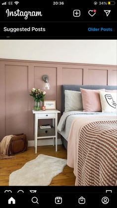 a bed room with a neatly made bed and pink walls