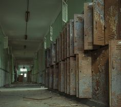 an old hallway with lots of rusty lockers