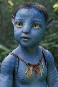 a young man with blue skin and yellow eyes is dressed as avatar from the film avatar