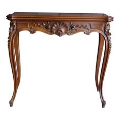 an ornate wooden table with carvings on the top and bottom edge, against a white background