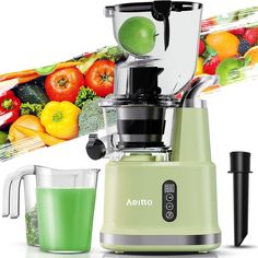 a green juicer sitting next to a blender filled with fruit and vegetables