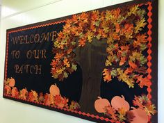 a bulletin board decorated with fall leaves and pumpkins