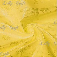 a yellow fabric with flowers and leaves on the bottom, it is very soft enough to use