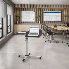 an empty conference room with tables and chairs