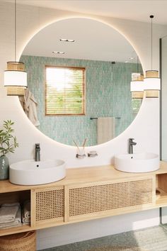 a bathroom with a sink, mirror and towel rack on the wall in front of it