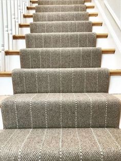 the carpeted stairs in this house are clean and ready for us to walk down