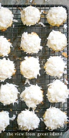 coconut cookies with white frosting on a cooling rack in front of the camera text reads, the view from great island