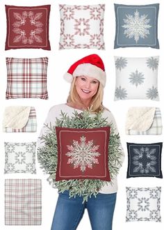 a woman holding up a christmas pillow with snowflakes and holly wreaths on it