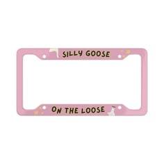 a pink license plate frame that says, silly goose on the loose with an image of a cat