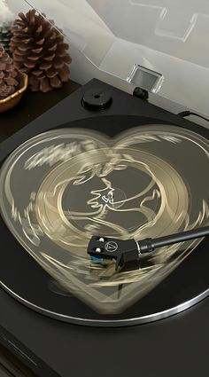 a turntable with a heart shaped design on it