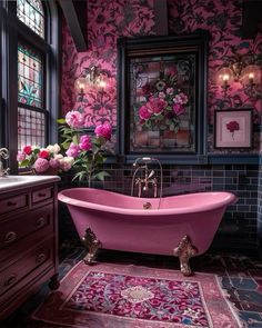 a pink bath tub sitting in a bathroom next to a window with flowers on it