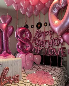 balloons and streamers in the shape of the letter s are on display at a birthday party