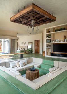 a living room filled with furniture and a flat screen tv