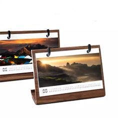 two wooden calendars with photos on them