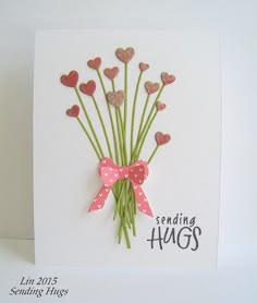 a card with some pink hearts on it