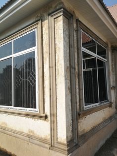 an old building with windows and bars on the outside