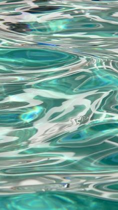 the water is very blue and green with ripples