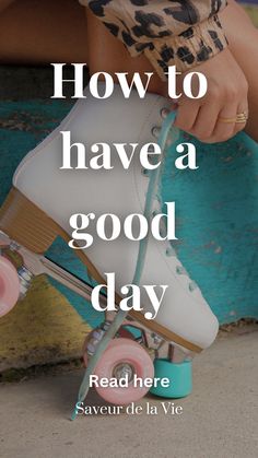 a person sitting on top of a skateboard with the words how to have a good day