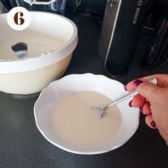 a person is mixing something in a bowl