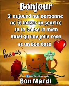 a coffee cup sitting on top of a table next to a red rose with the words bonjour