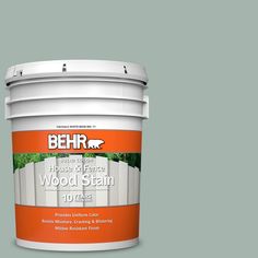 a white paint bucket with the words behrr house of greene wood stain on it