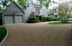 a driveway in front of a large house