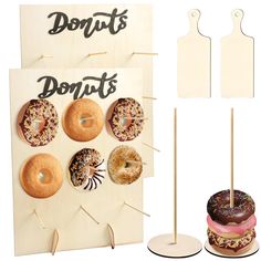 there are donuts that are on the sign and in front of them is a cake