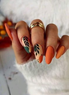 When I think about the cozy vibes of autumn, I can't help but get hyped over the rich palette that fall nail colors bring. It's like Mother Nature's runway show is at our fingertips, literally! Orange Holiday Nails Summer, Thank Giving Nails Design, Rust Orange Nails, Green And Orange Nails, Rust Nails, September Nails, Thanksgiving Nails, Autumn Nails, Nail Designs Spring