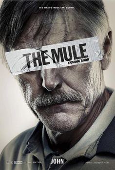 the mule movie poster with man's eye covered by newspaper strip over his face