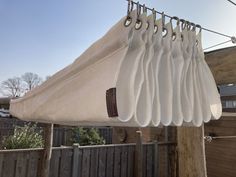 an umbrella is hanging on a clothes line