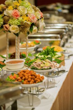 a buffet table filled with lots of food