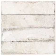 a white tile wall with three horizontal lines