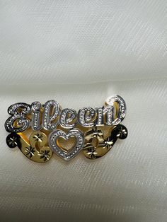 *10k or 14k solid gold double nameplates with heart, white gold and diamond cuts, made in 3 different sizes personalized and made to order. *Our name charms are made in either 10k or 14k solid gold (not filled or plated) and handcrafted made to order. *HOW TO ORDER: select: Double name charm material and size. -medium 1.5"x5/8"inches (up to 4mm necklace size fits) -large 1.7"x6/8"inches (up to 6mm necklace size fits) -XL 2"x1"inches (up to 8mm necklace size fits) notes: the charm in the picture Silver Heart-shaped 14k Gold Name Necklace, Silver Jewelry With Custom Name In Double Heart Shape, Silver Double Heart Jewelry With Custom Name, Personalized Silver Name Necklace With Double Heart, Silver Double Heart Name Necklace With Custom Name, Silver Double Heart Custom Name Necklace, Personalized Double Heart Silver Name Necklace, Silver Double Heart Name Necklace For Anniversary, Silver Double Heart Necklace For Anniversary