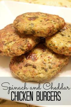 spinach and cheddar chicken burgers on a white plate with the title