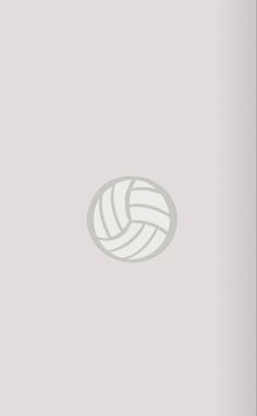 a volleyball ball sitting on top of a white wall