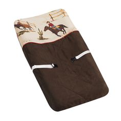 a brown and white blanket with horses on it's back, in the shape of a cowboy