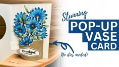 a pop up vase card with blue flowers on it