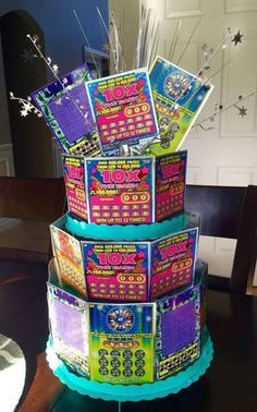 there is a three tiered cake made to look like a lotto game machine