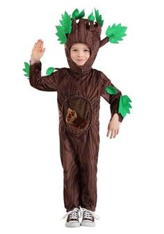 a little boy in a costume that looks like a baby groote with green leaves on his head