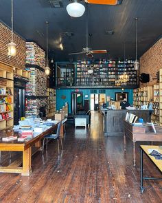 the inside of a book store with wooden floors and bookshelves filled with books