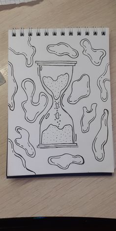 a drawing of an hourglass on top of a table